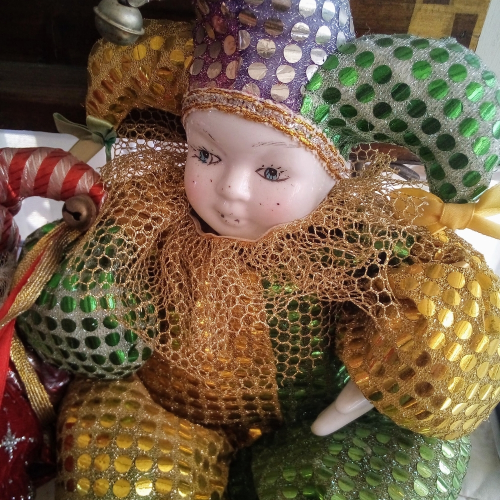 Two porcelain clown dolls